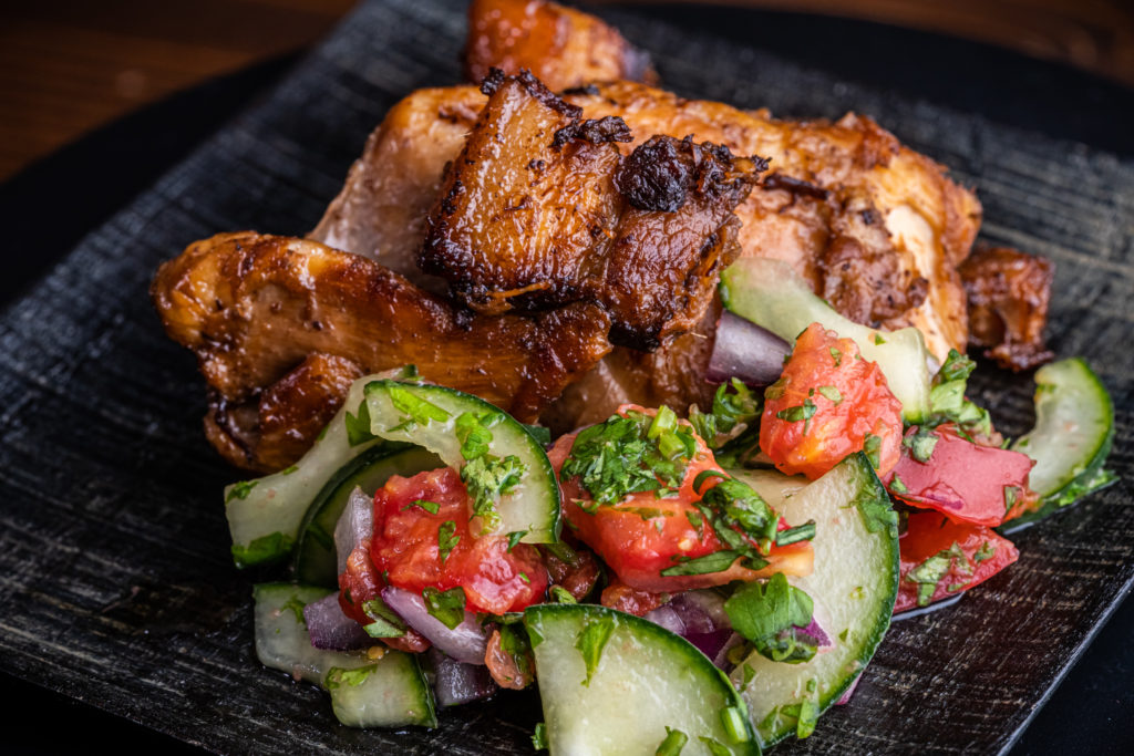 chicken and pork belly adobo, with the cucumber tomato relish