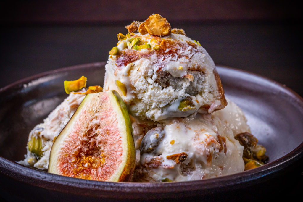 fig ice cream topped with pistachios