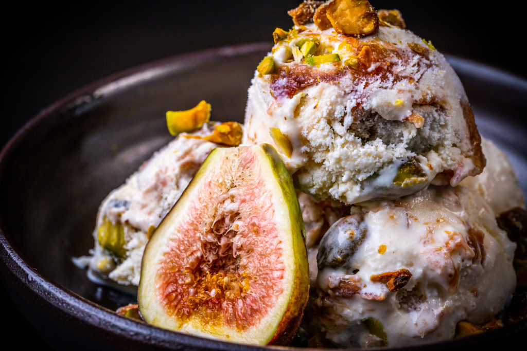 fig ice cream topped with pistachios